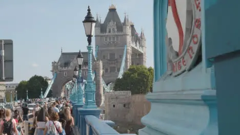 Summer Tourists Walking By Tower Bridge London England UK With Traffic 1