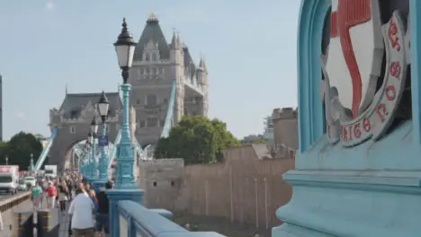 Summer Tourists Walking By Tower Bridge London England UK With Traffic 2