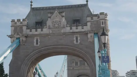 Summer Tourists Walking Across Tower Bridge London England UK With Traffic