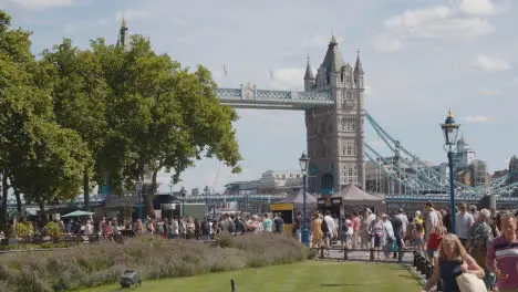 Crowd Of Summer Tourists Walking By Tower Bridge London England UK 2