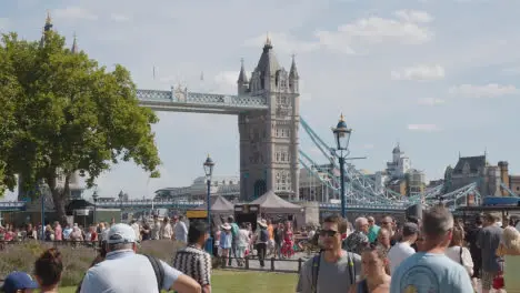 Crowd Of Summer Tourists Walking By Tower Bridge London England UK 3