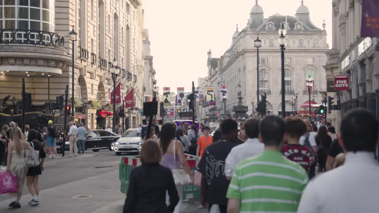 Crowd Of Summer Tourists Walking From Leicester Square Towards Piccadilly Circus In London England UK 2