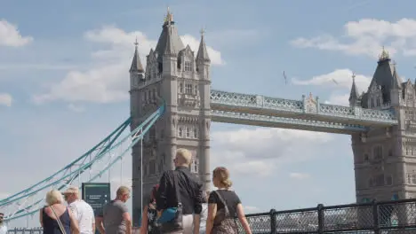 Crowd Of Summer Tourists Walking By Tower Bridge London England UK 6