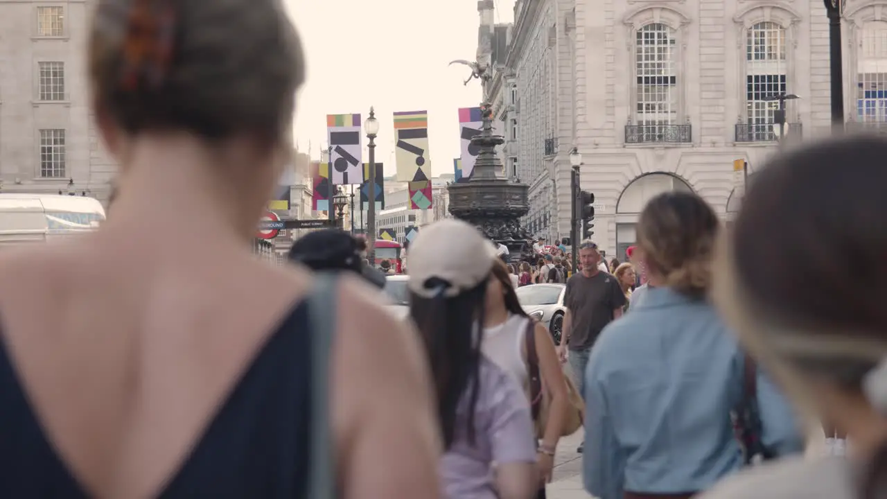 Crowd Of Summer Tourists Walking Around Piccadilly Circus And Statue Of Eros In London England UK 3