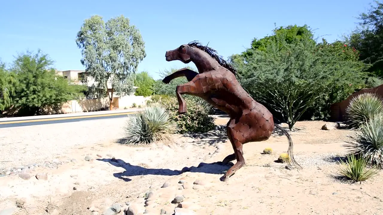 Sculpture of a large metal horse on hind legs