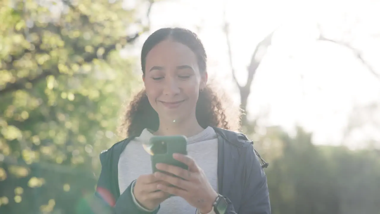 Woman smartphone and texting in park