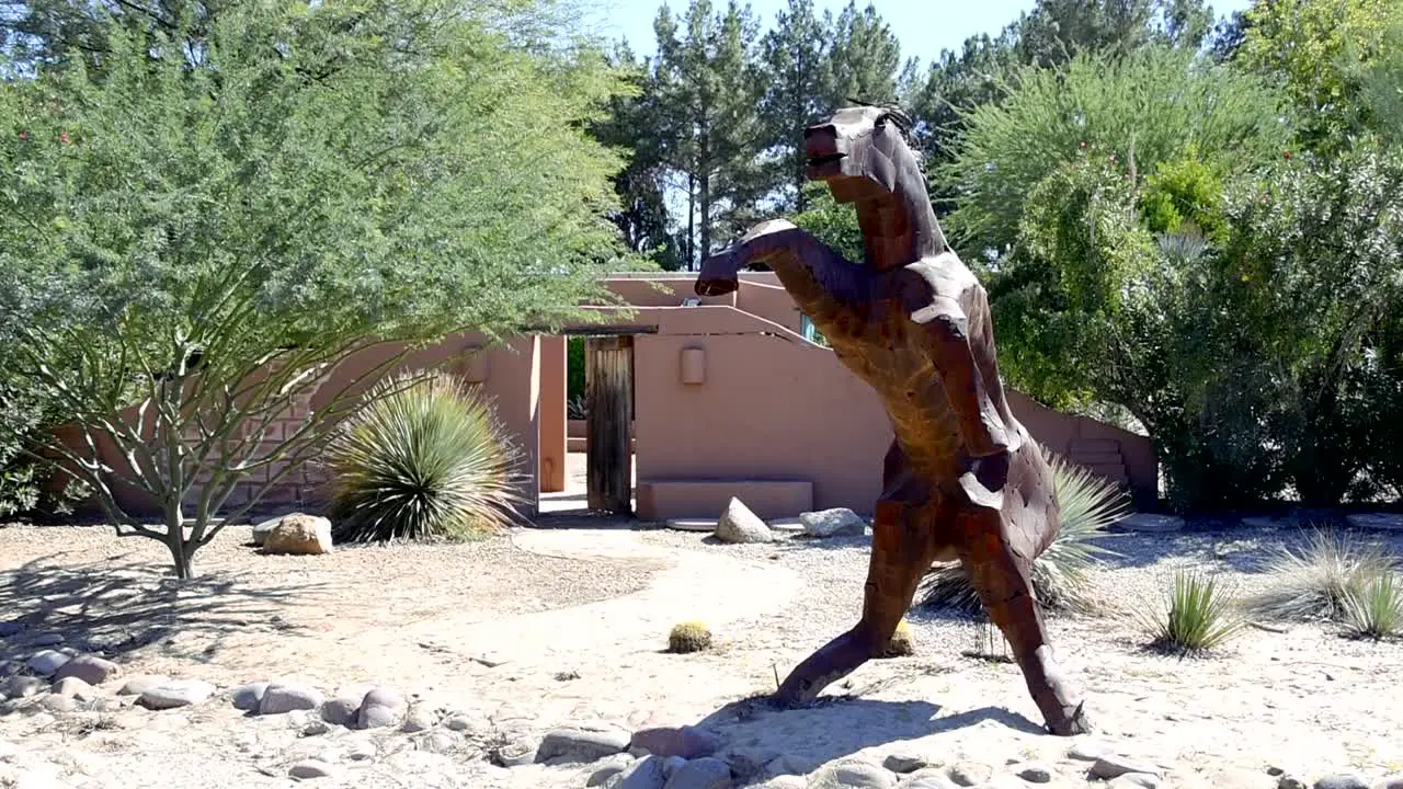 Sculpture of a large metal horse on hind legs straight on view