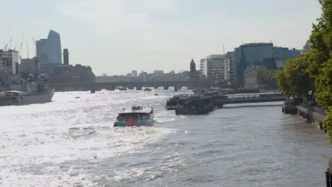 View From Tower Bridge Towards City Skyline Of River Thames With HMS Belfast And Tourist Boats