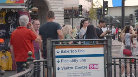 Entrance To Piccadilly Underground Tube Station And Tourist Souvenir Stalls At Piccadilly Circus London England UK