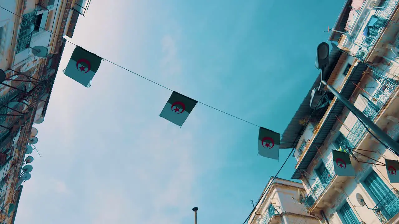 small flag of Algeria as a pennant in an alley in the city of Algiers