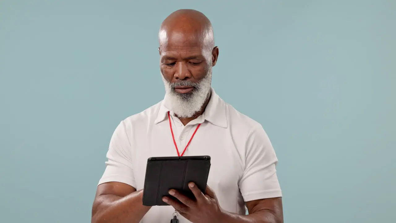 Happy black man or coach with a tablet on a blue