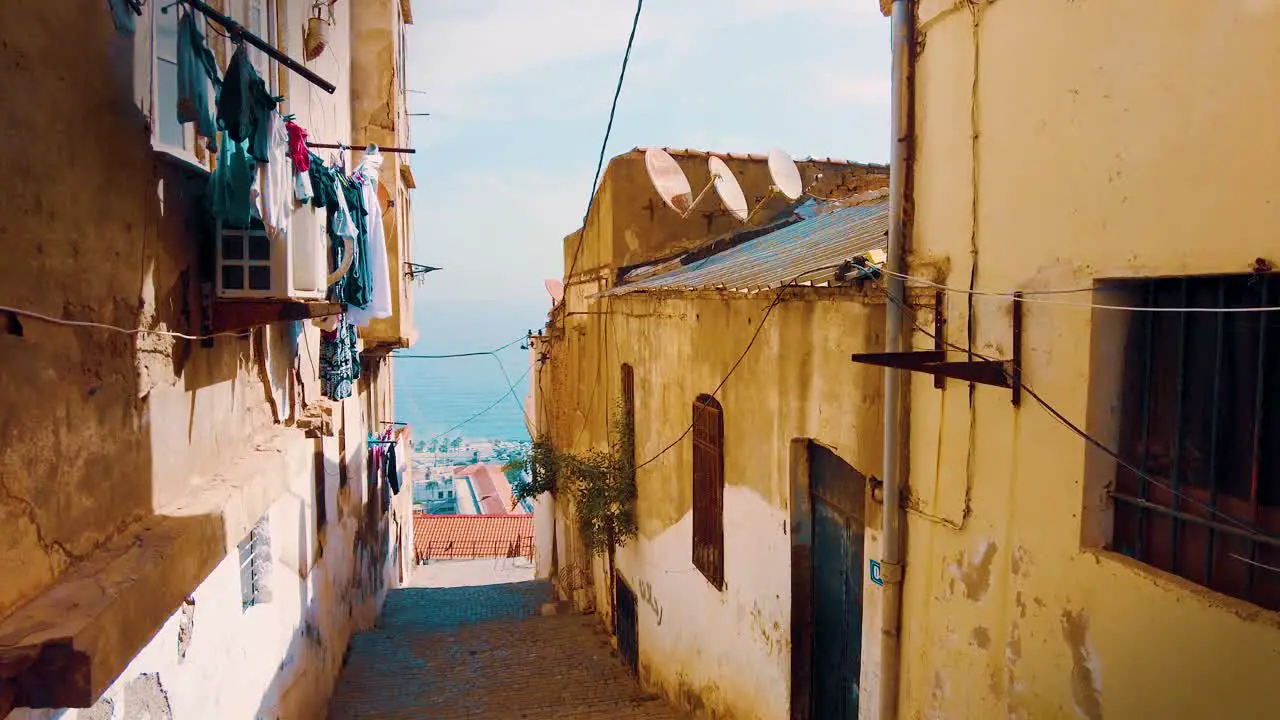 A small alley in the Kasbah district of Algiers which overlooks the Mediterranean Sea in the background