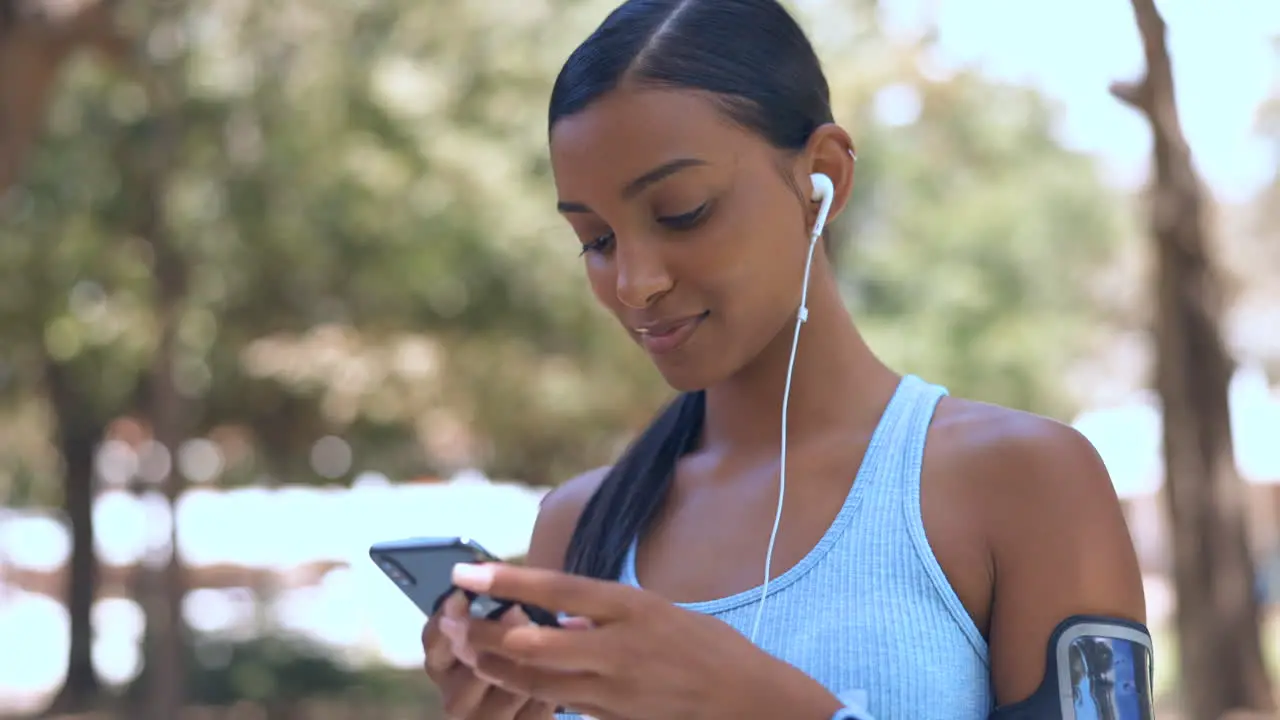 Music earphones phone and fitness woman outdoor