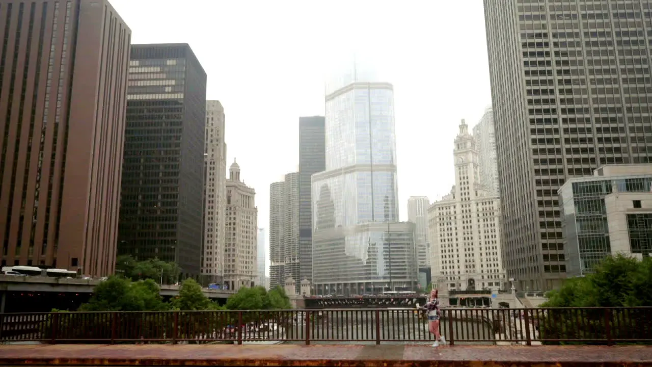 Cityscape Brunette woman standing on chicago river bridge Chicago skyline