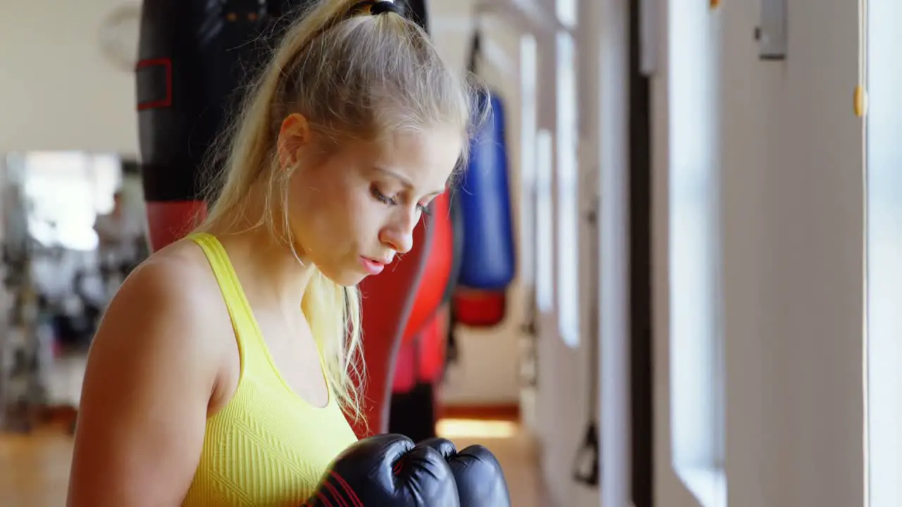 Female boxer practicing boxing 4k