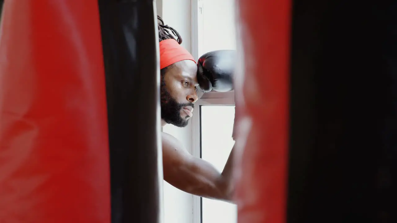 Male boxer standing in fitness studio 4k