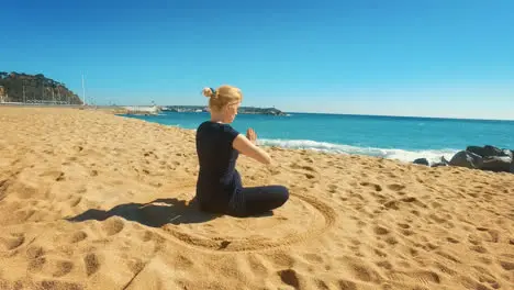 Fit girl practicing yoga outdoors at sunny day Young woman meditating