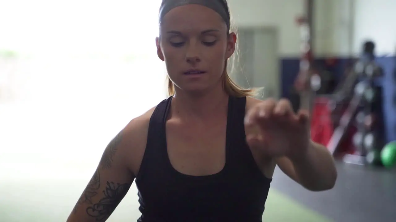 Female athlete performing leg stretches before a workout