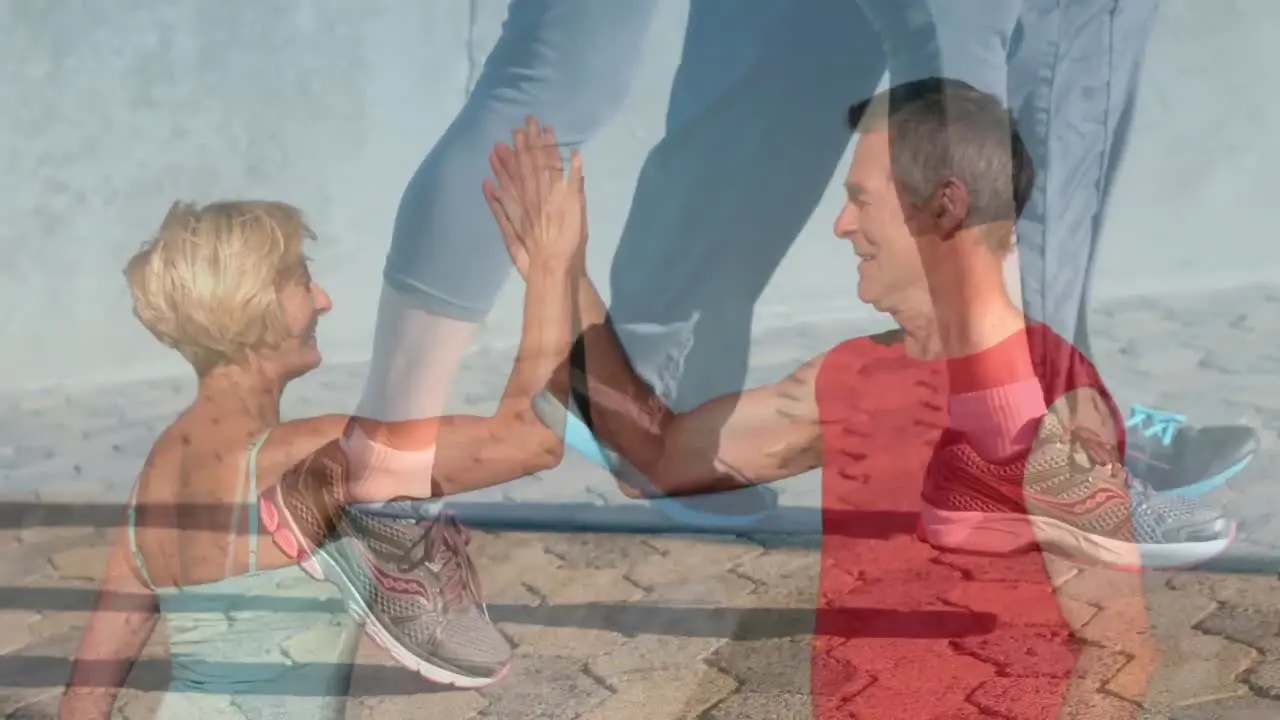 Animation of senior caucasian couple highfiving over over diverse people running