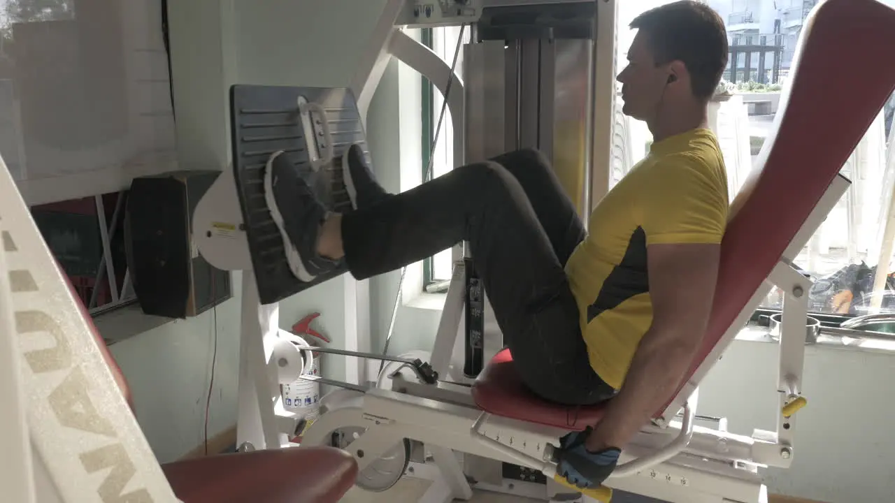 Man working out on leg press machine