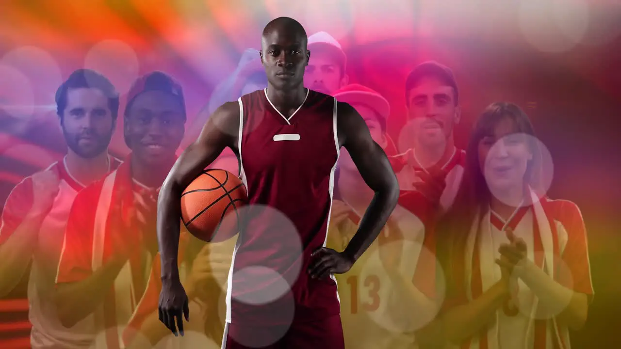 Spots of light over portrait of african american male basketball player against fans cheering