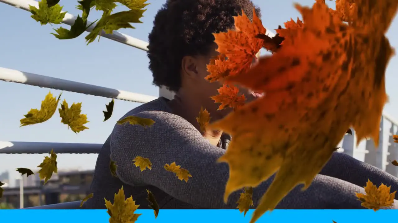 Multiple leaves icon falling against african american man taking a break from running on the bridge