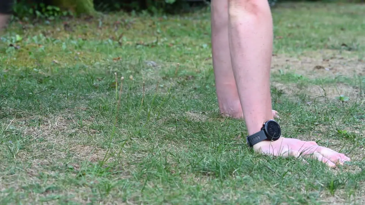 A young calisthenics athlete is doing pushups on the ground to grow his chest