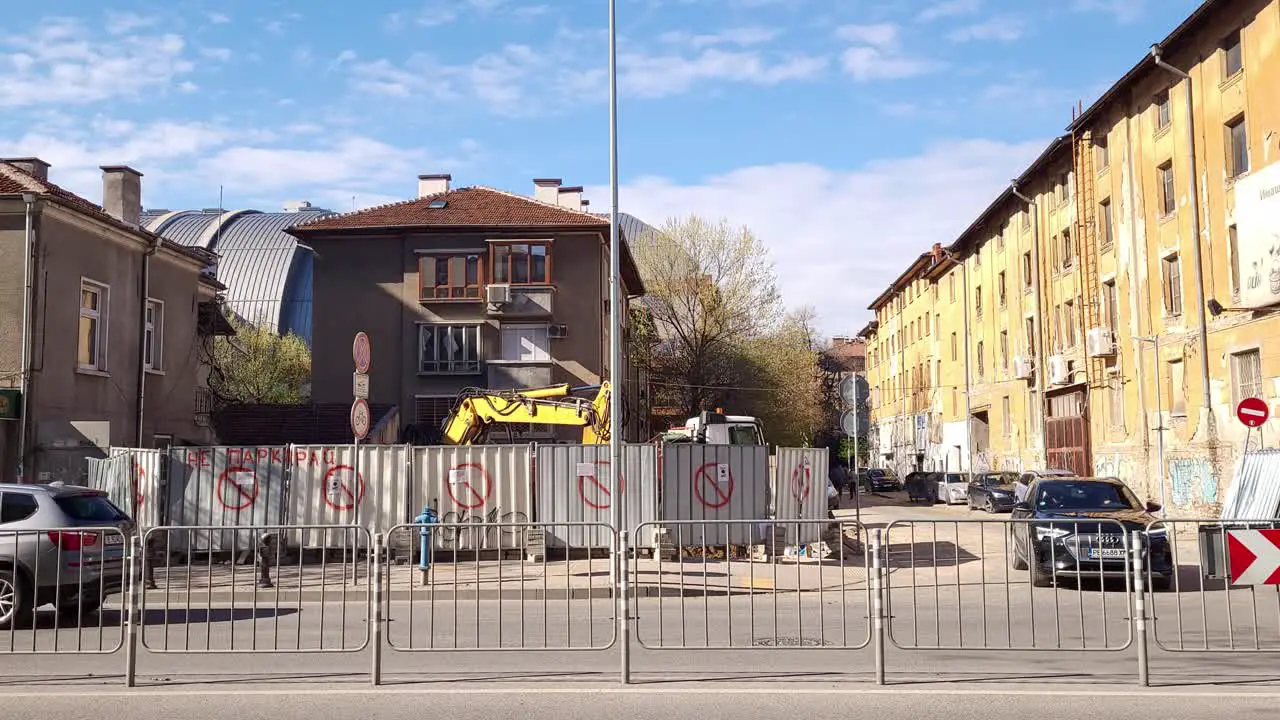 Midday footage of a Digger doing construction work on Vasil Aprilov Blvd