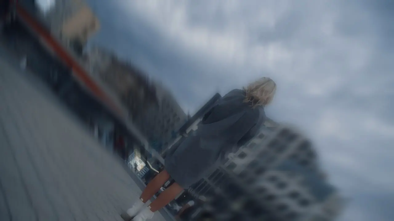 Alone woman watching clouds at city landscape in evening street lights