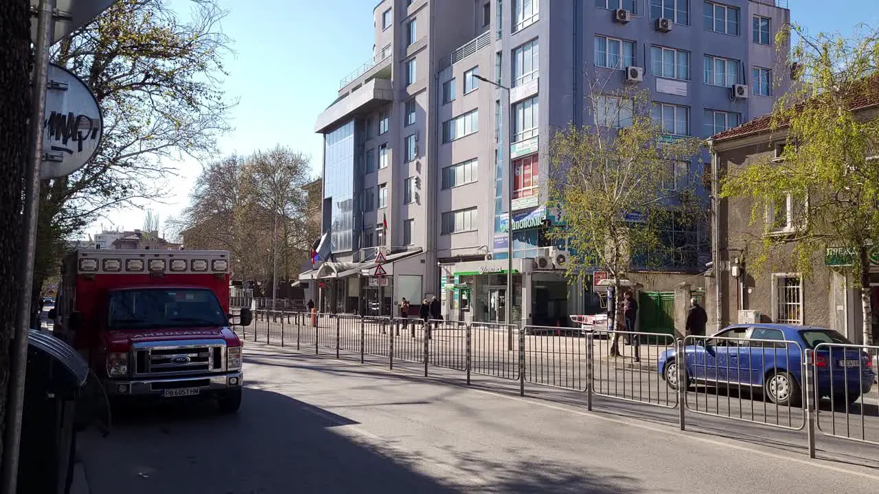 Light traffic passing by a Ford ambulance parked on 'Vasil Aprilov'' Blvd