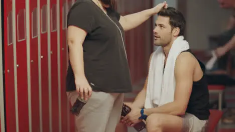 Funny female stylist tidying man hair in checking room