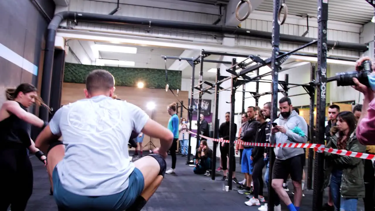 Energetic male athlete jumps with agility and power onto a CrossFit box