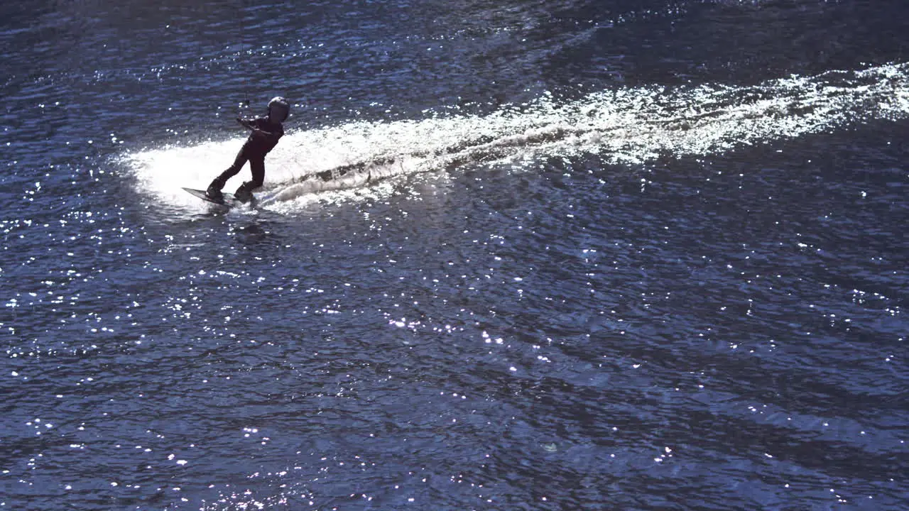 Boy riding on wakeboard