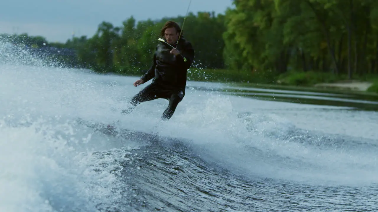 Man wakeboard boat on river