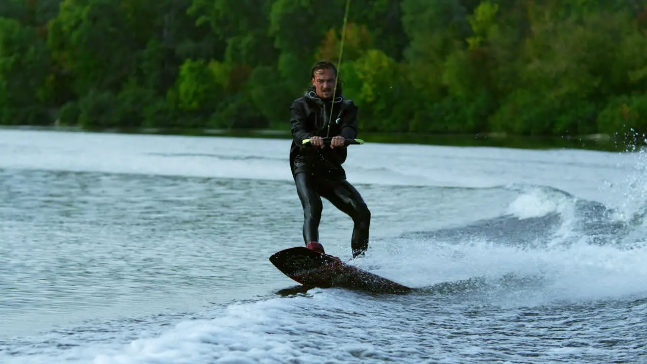 Man wakeboarding on river