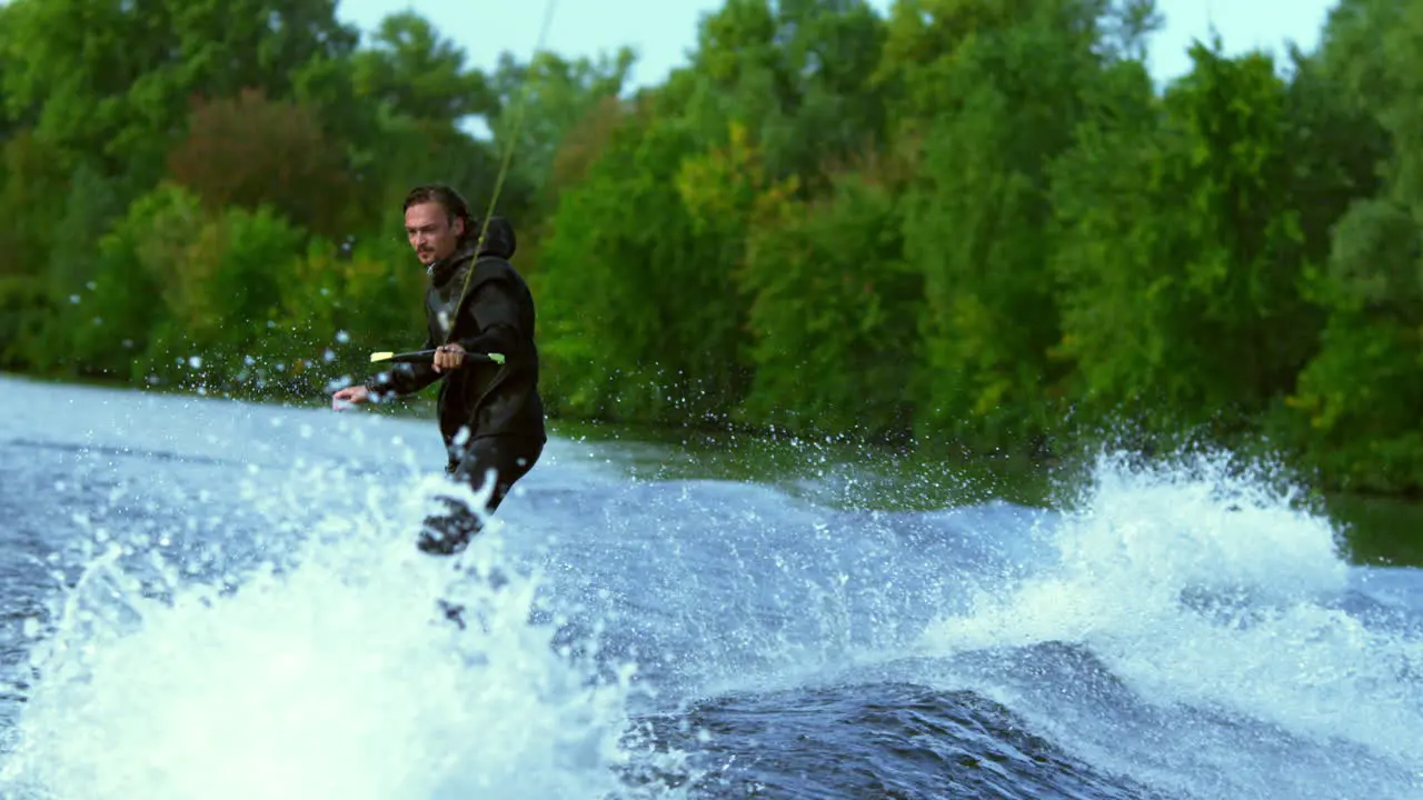 Man riding board on waves