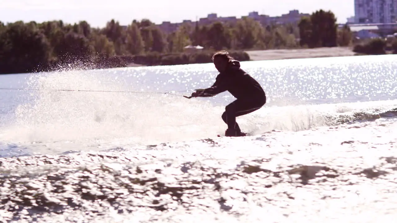 Wake board rider jumping on river waves