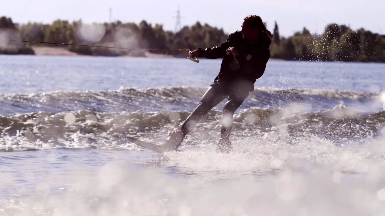 Surfer making trick on wakeboard