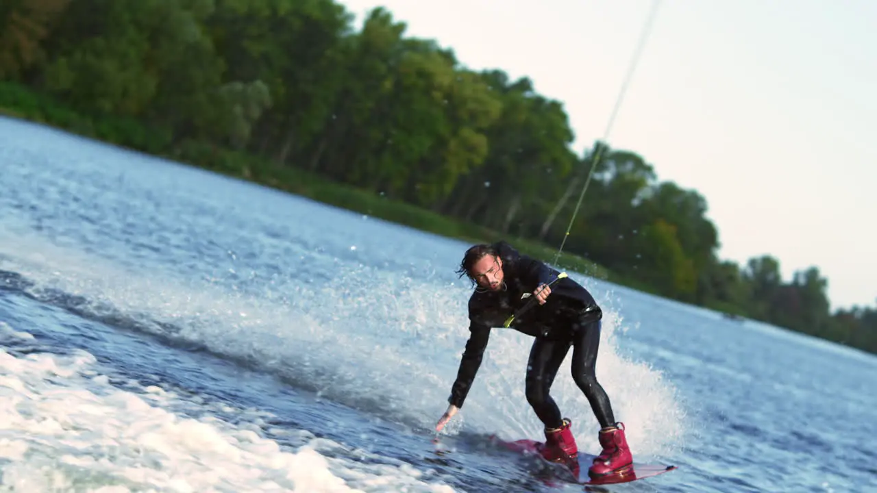 Wakeboarder riding on river