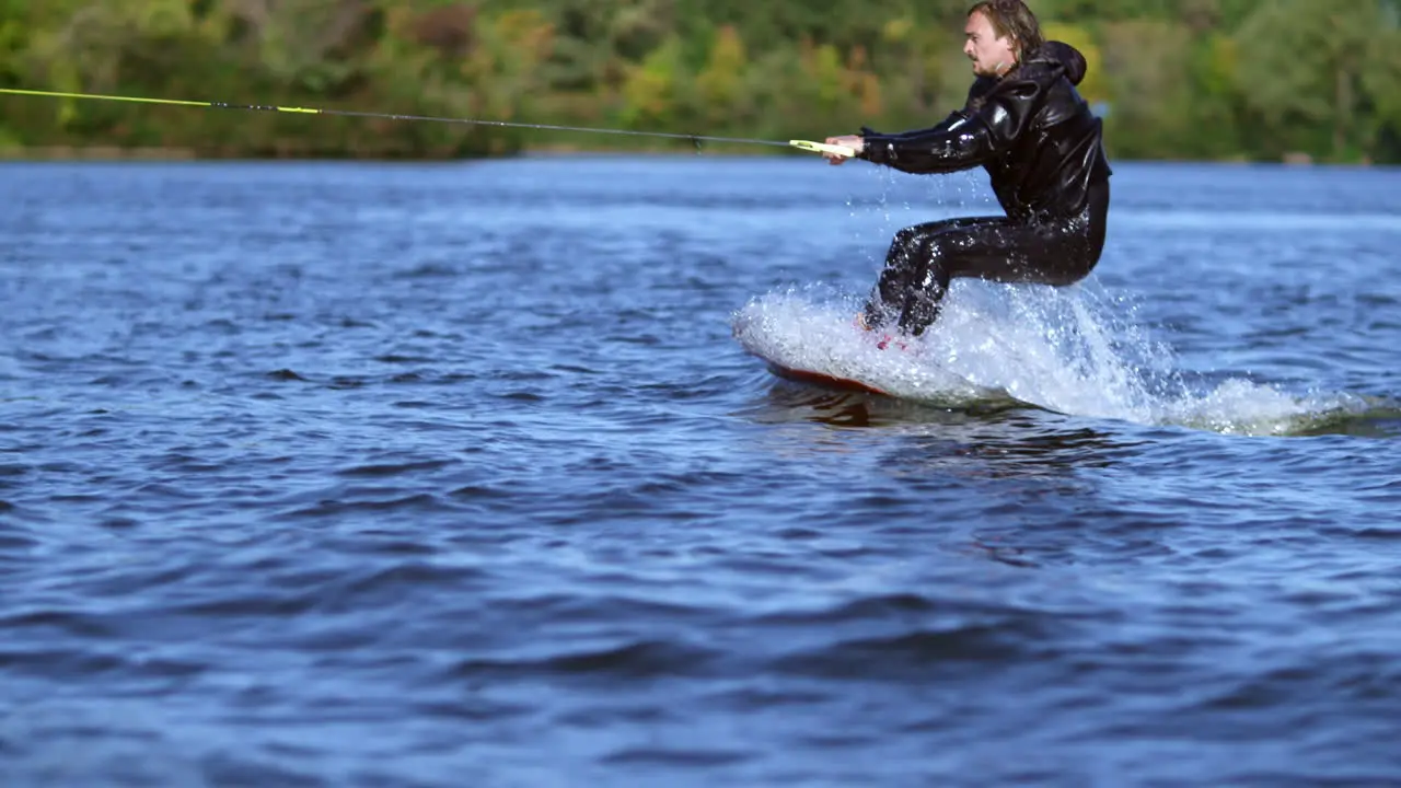 Sportsman riding on wakeboard