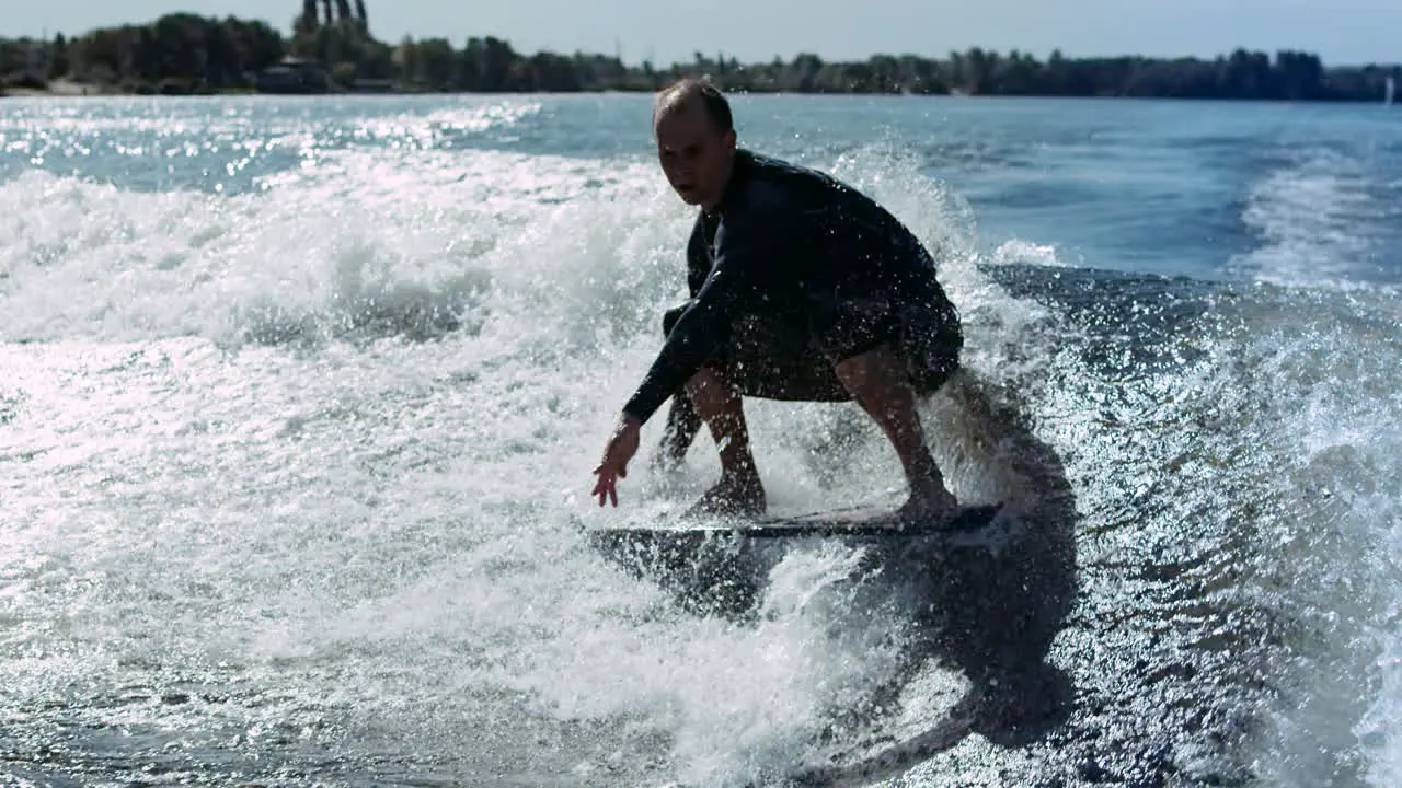 Man rotating on wake surf