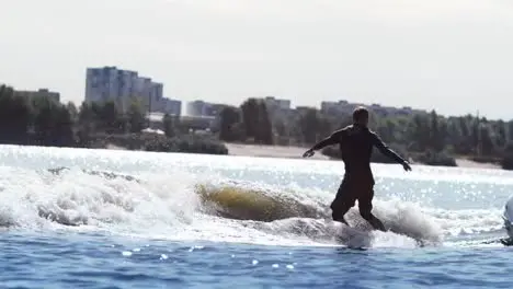 Man riding on wakeboard Sport failing on water Extreme sports