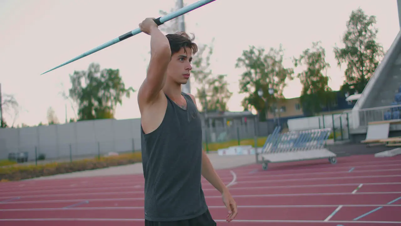 Javelin thrower before a throw Concentration and exhalation Excitement and fear before the throw Confident look and run at the stadium of an athlete performing the javelin throw