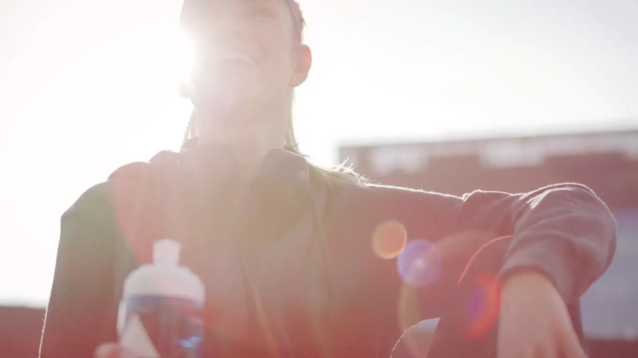 Low angle view of woman taking a sip of refreshing water