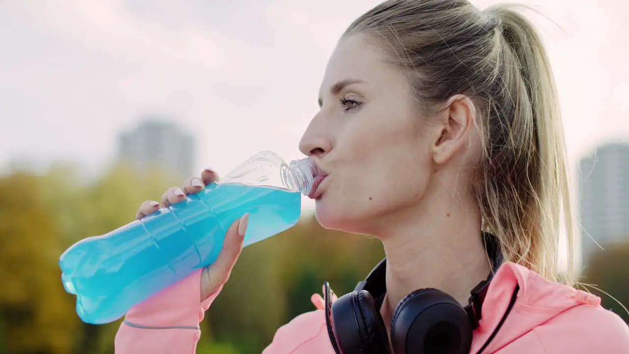 Handheld view of woman taking a sip of refreshing water