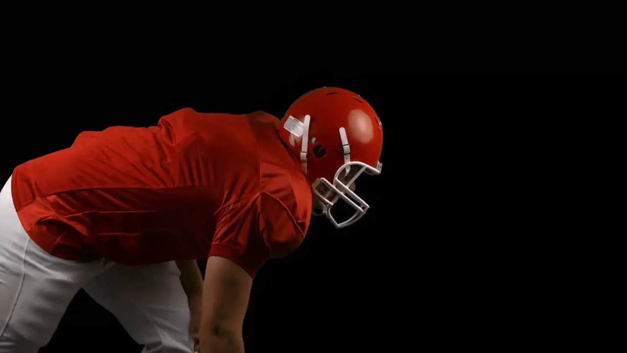 American football player on black background