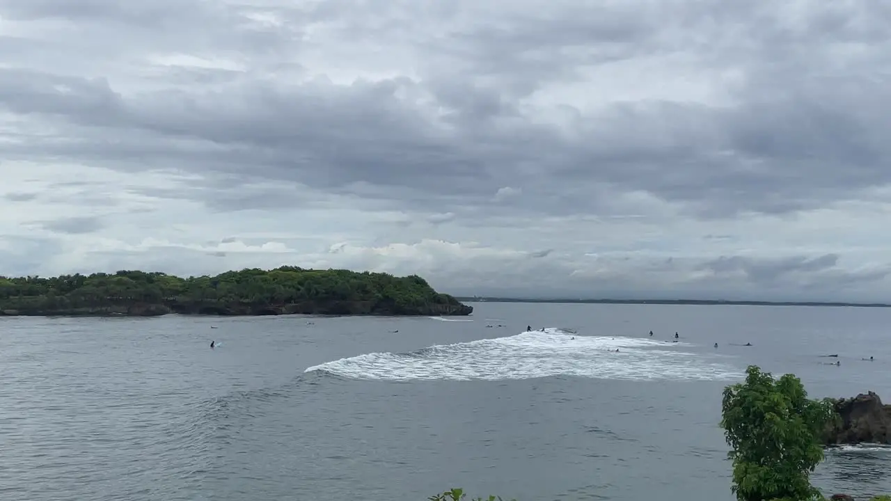 People surfing in water as waves coming in