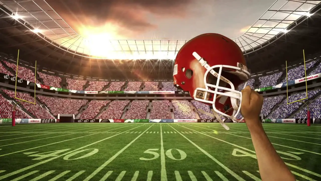  American football player holding his helmet