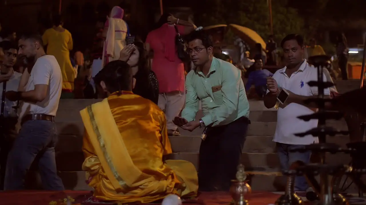 Ganga Aarti Attendees Receive Handfuls of Water