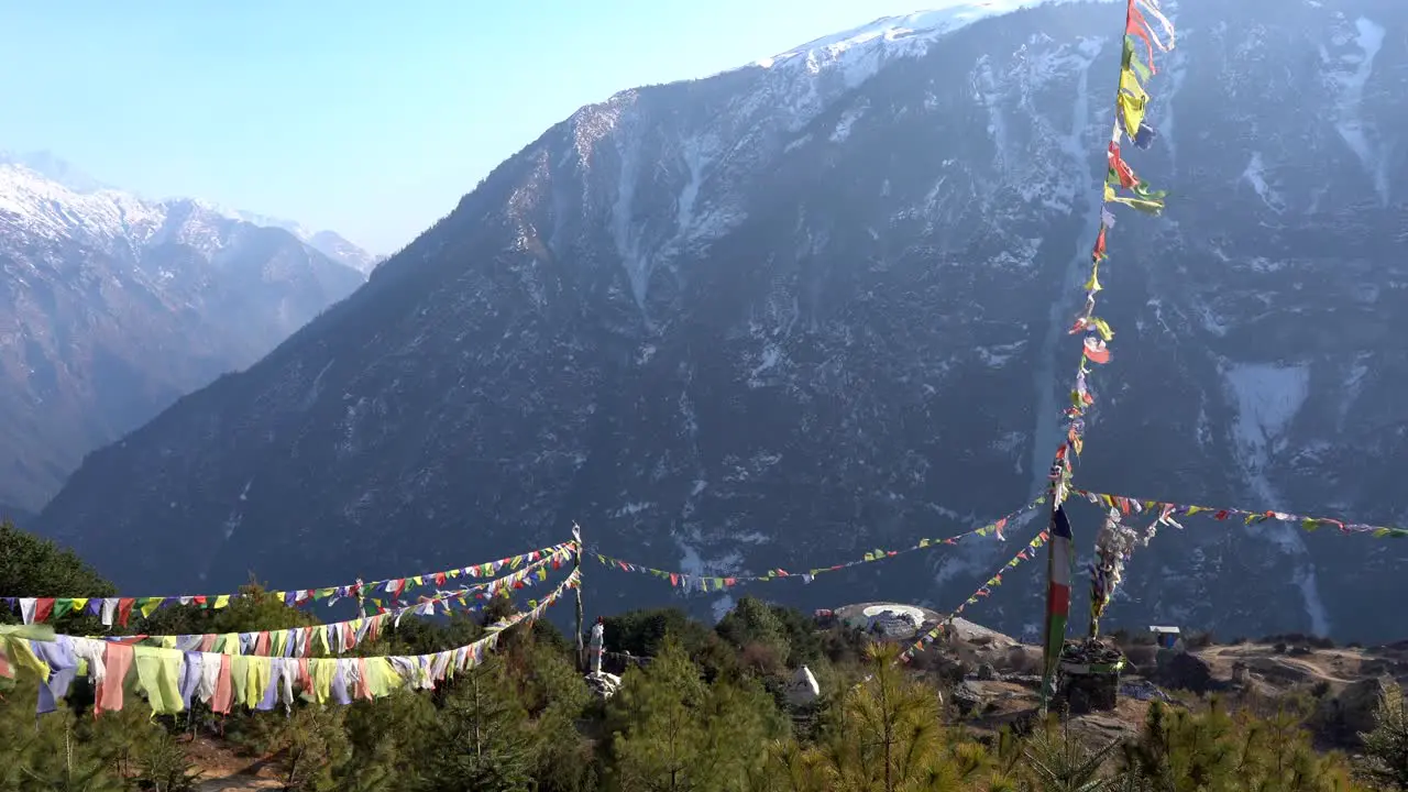 Prayer flags waving in the wind in the mountains of Nepal